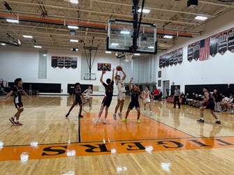 Newton North boys basketball clinches Bay State Conference championship with win over Brookline