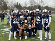 Deacon Robillard throws three touchdowns in St. John’s Prep’s soggy win over Xaverian