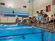 Belchertown boys, Northampton girls swimming win as Luke Giguere continues state title redemption